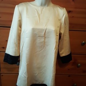Dress  beige with black trim. Looks like silk.